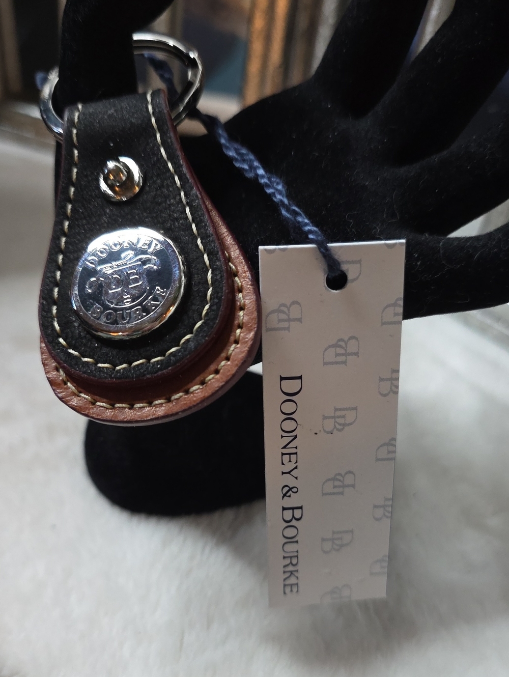 Dooney & Bourke Black and Brown Leather Key Holder with Silver Tone Logo